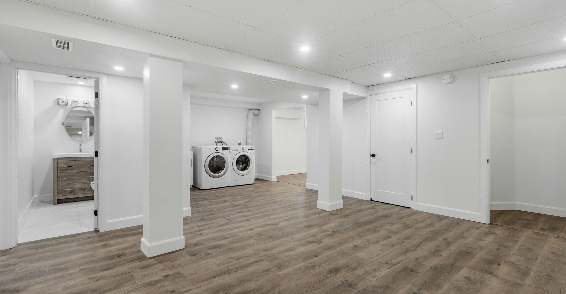 an empty room with a washer and dryer